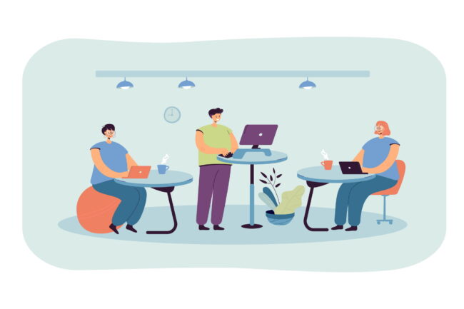 Office employees working at ergonomic workplaces